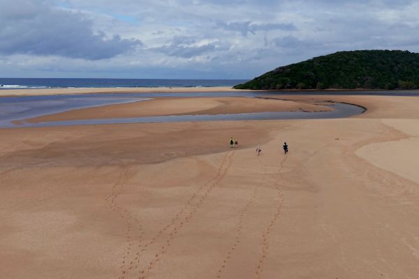 Hikers crossing exposed sandbanks at Kosi Bay estuary